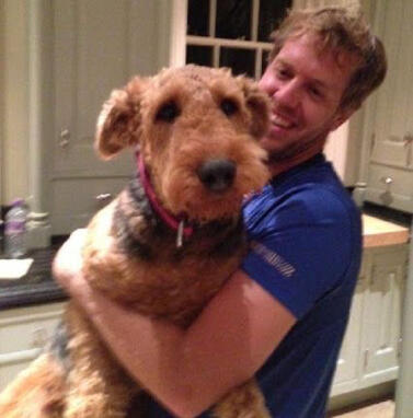 sebastian vettel with a dog